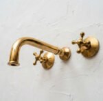 Unlacquered Brass Wall Mounted Bathroom Faucet with Cross Handles