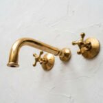 Unlacquered Brass Wall Mounted Bathroom Faucet with Cross Handles