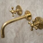 Handcrafted 3-Hole Unlacquered Brass Wall Mounted Vanity Faucet